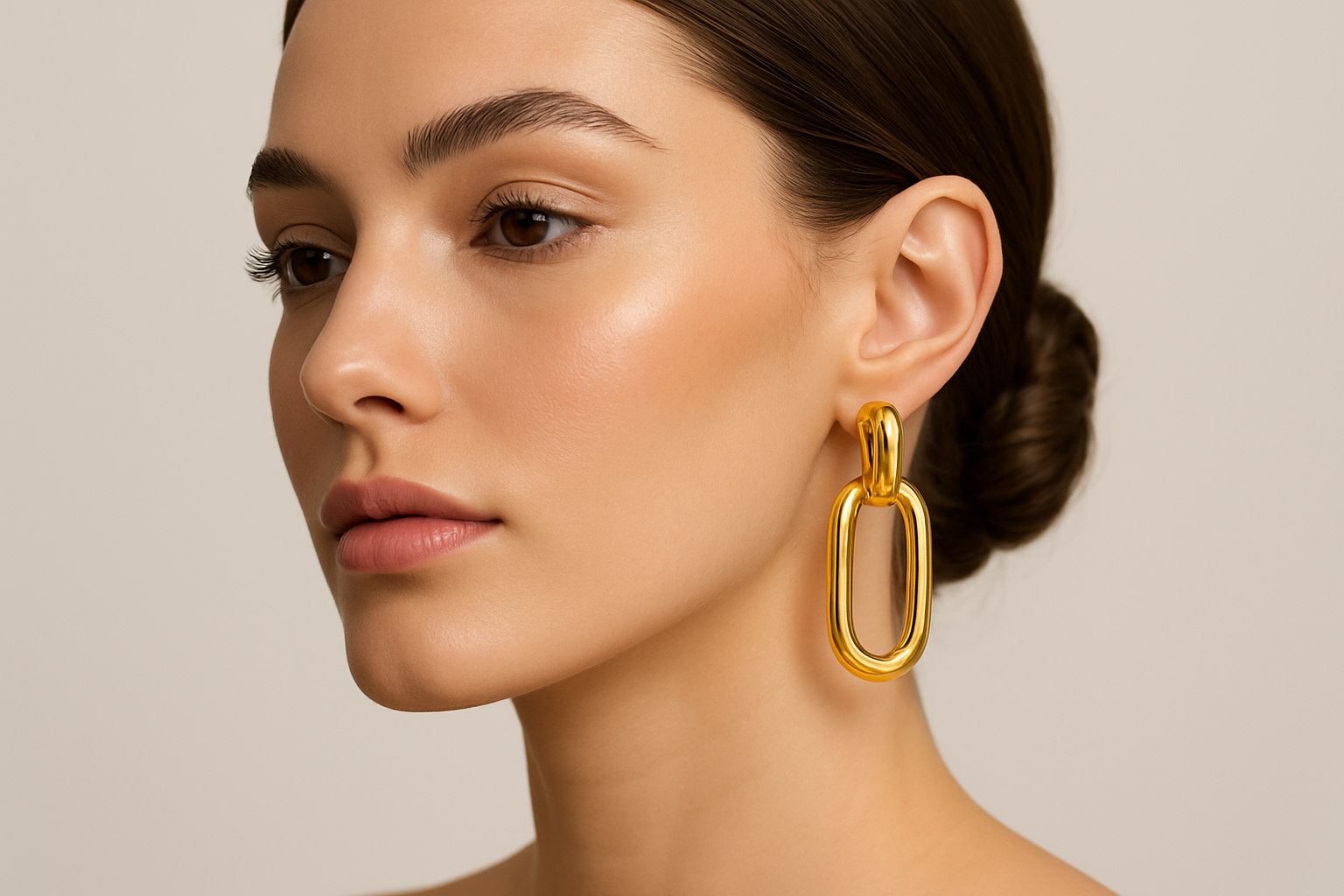 Gold plated stainless steel earring on a model